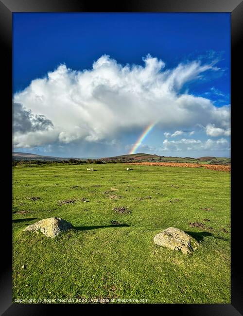 Dartmoor's rainbow sky Framed Print by Roger Mechan