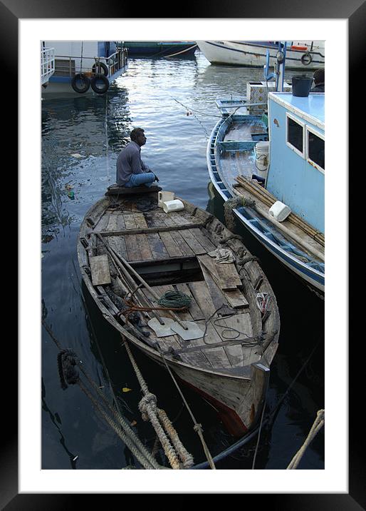 alone on boat Framed Mounted Print by Hassan Najmy
