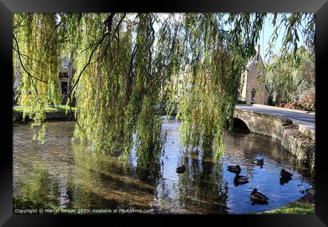 Willow trees in Bourton on the water Framed Print by Martin fenton