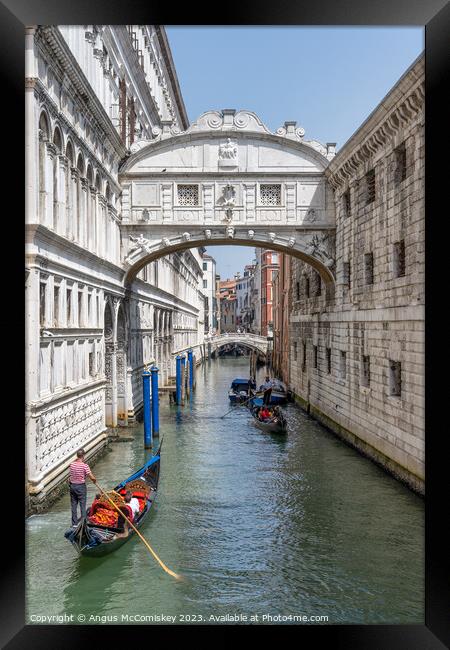 Gondolas under the Bridge of Sighs in Venice Framed Print by Angus McComiskey