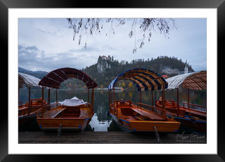 Colored Pletna Boats on Lake Bled, Slovenia. Framed Mounted Print by Maggie Bajada