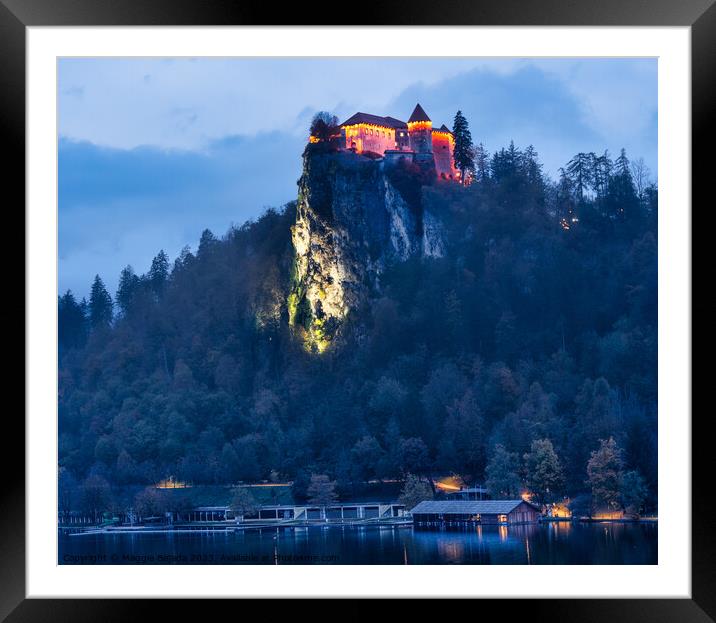 Lit Up Castle Bled on Lake Bled during Blue Hour. Framed Mounted Print by Maggie Bajada