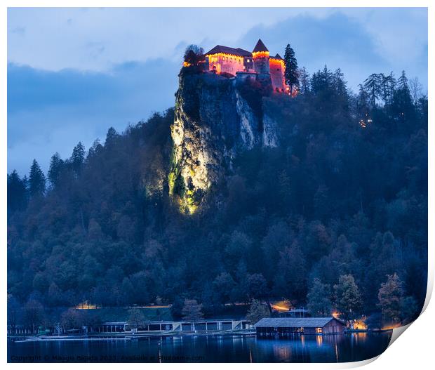 Lit Up Castle Bled on Lake Bled during Blue Hour. Print by Maggie Bajada