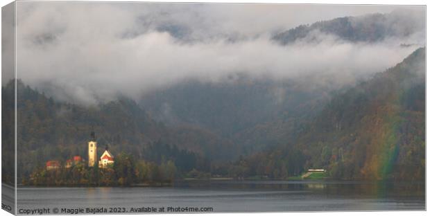 Lake Bled with Mountains and Rainbow. Canvas Print by Maggie Bajada
