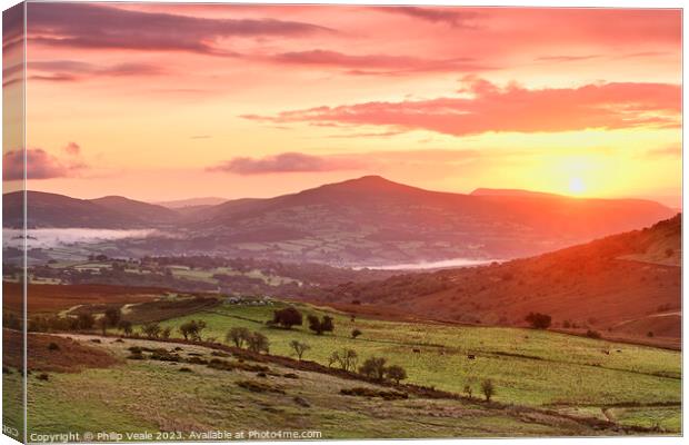 Sugar Loaf and Skirrid Golden Sunrise. Canvas Print by Philip Veale