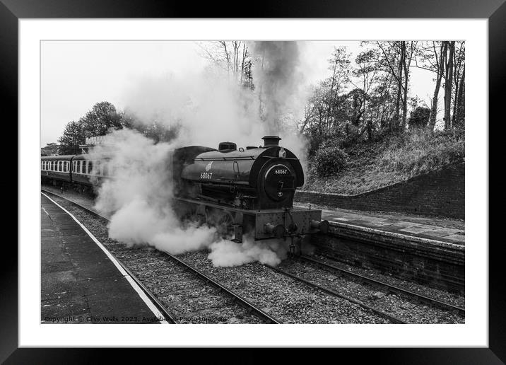 Stean train now leaving Llangollen Station in monochrome Framed Mounted Print by Clive Wells