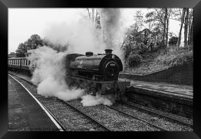 Stean train now leaving Llangollen Station in monochrome Framed Print by Clive Wells
