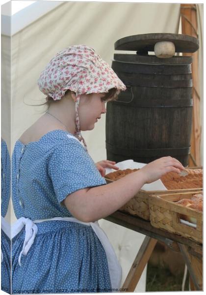 Woman baking bread, Civil War Reenactment; girl at counter Canvas Print by Arun 