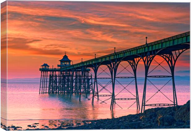 Clevedon Pier at sunset on a calm evening with cloud and blue sky above Canvas Print by Rory Hailes