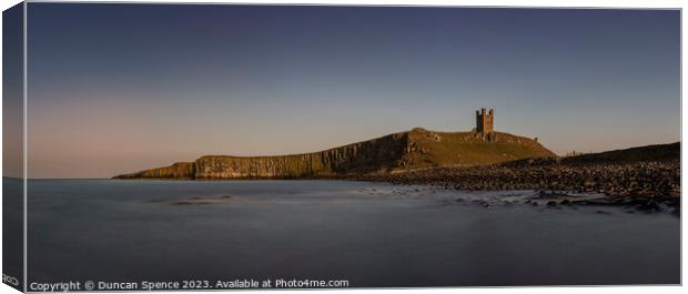 Dunstanburgh Castle at sunset Canvas Print by Duncan Spence