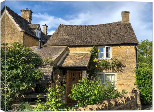 Wishing well cottage Bourton on the water. Canvas Print by Martin fenton