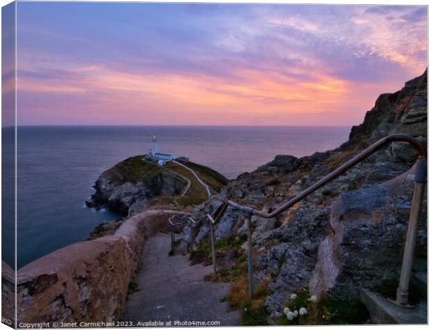 Gentle Sunset Colours over South Stack Lighthouse Canvas Print by Janet Carmichael