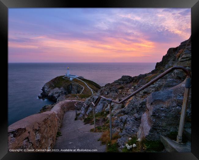 Gentle Sunset Colours over South Stack Lighthouse Framed Print by Janet Carmichael
