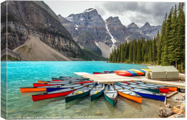 Red Canoe Moraine Lake Blue Water Canvas Print by Pierre Leclerc Photography
