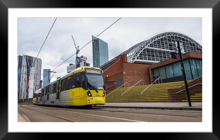 Yellow tram passing the Manchester Central Convention Complex Framed Mounted Print by Jason Wells