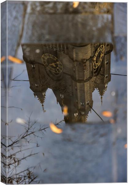 Reflection of the highest part of the clock tower. Canvas Print by Olga Peddi
