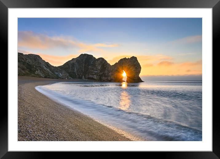 Sunrise through the arch of Durdle Door Dorset  Framed Mounted Print by Shaun Jacobs