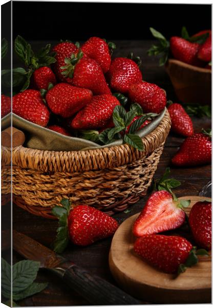 Fresh strawberries in a basket  Canvas Print by Olga Peddi