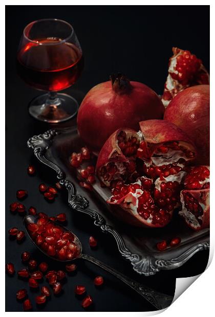 Still life of pomegranates on a black background Print by Olga Peddi