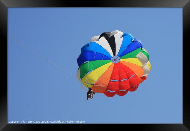 Parachute on a clear blue sky Framed Print by Tony Davis