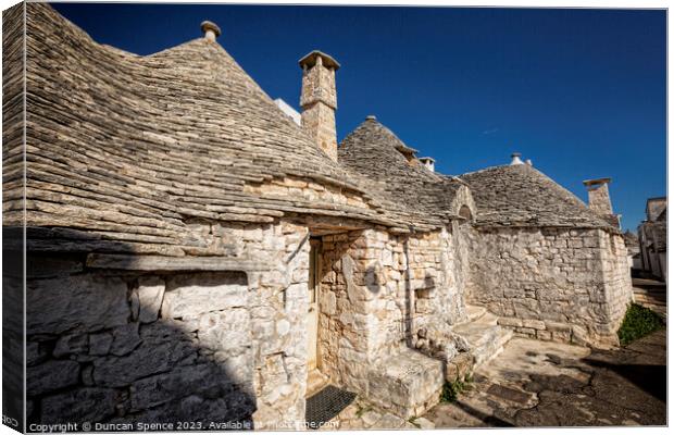 Trulli Houses Canvas Print by Duncan Spence