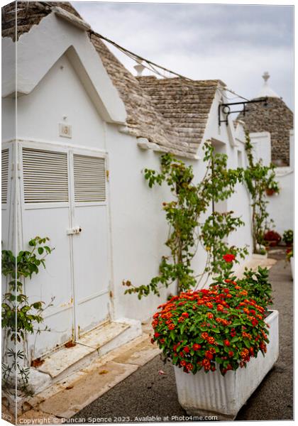 Tulli Houses of Alberobello Canvas Print by Duncan Spence