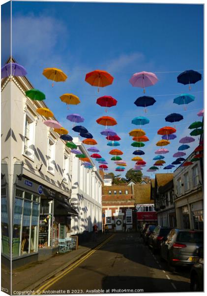 Bank Street with  umbrellas Hythe Kent  Canvas Print by Antoinette B