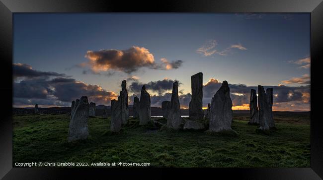 Calanais Standing Stones at sunset Framed Print by Chris Drabble
