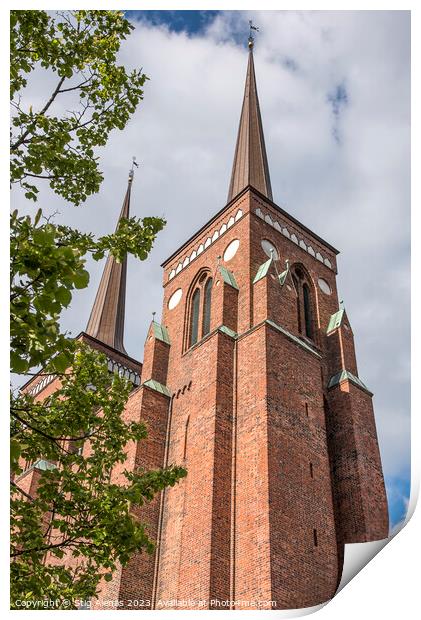 the red brick towers of Roskilde cathedral reach up in the sky Print by Stig Alenäs