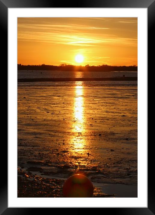 Sun setting across the Brightlingsea Creek  Framed Mounted Print by Tony lopez
