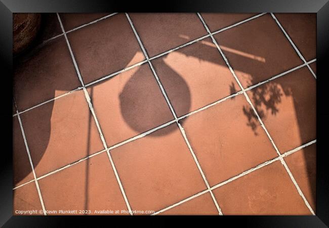 Shadows on floor tiles Framed Print by Kevin Plunkett