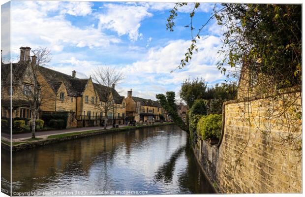 Bourton on the water river reflections Canvas Print by Martin fenton