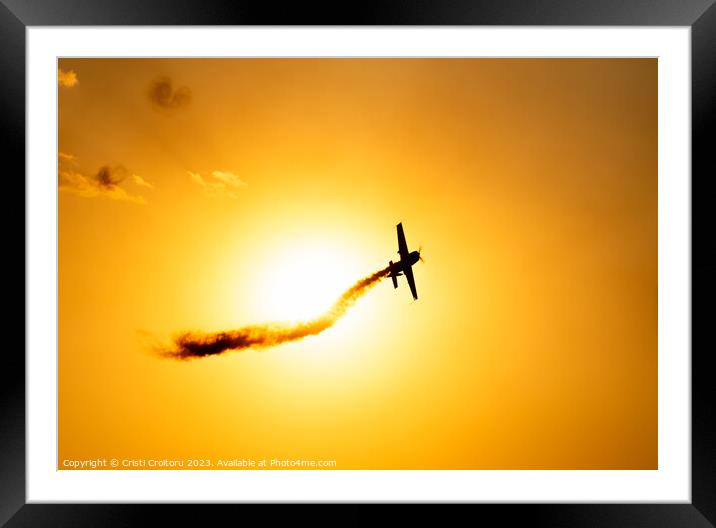 Airplane flying at sunset.  Framed Mounted Print by Cristi Croitoru