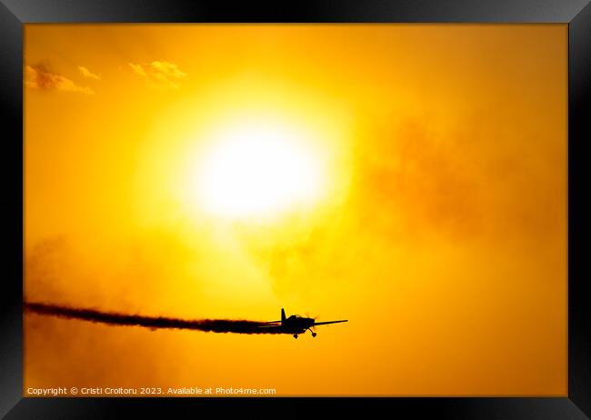 Airplane flying at sunset.  Framed Print by Cristi Croitoru