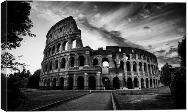 The fascinating sunset silhouette of the Colosseum in black and white. Canvas Print by Guido Parmiggiani