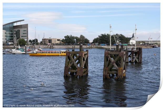 Cardiff bay wooden piers Print by Kevin Round