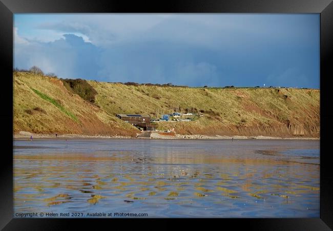 Filey yacht sailing club nestled in the cliffs Framed Print by Helen Reid