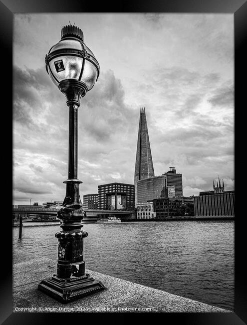 Lamp and Shard Framed Print by Roger Dutton