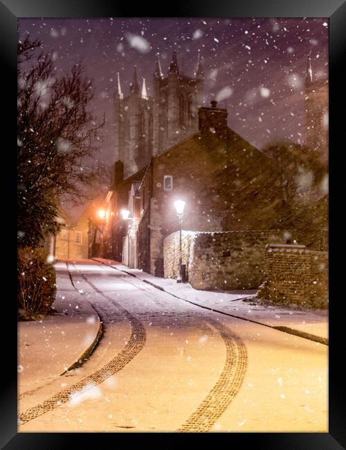 Snow falling in Lincoln  Framed Print by Andrew Scott
