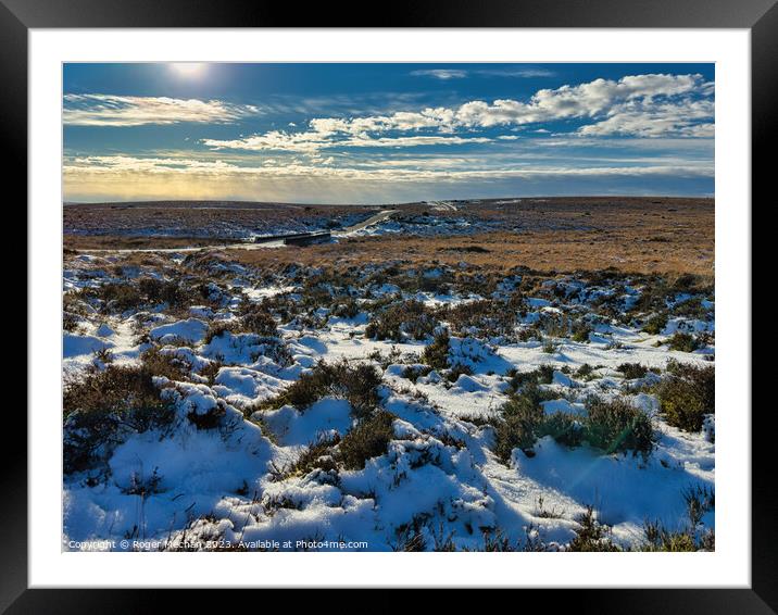 Dartmoor. Lonely road and snowy moorland. Framed Mounted Print by Roger Mechan