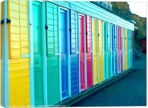Colourful beach huts at Cromer,Norfolk, UK. Canvas Print by john hill