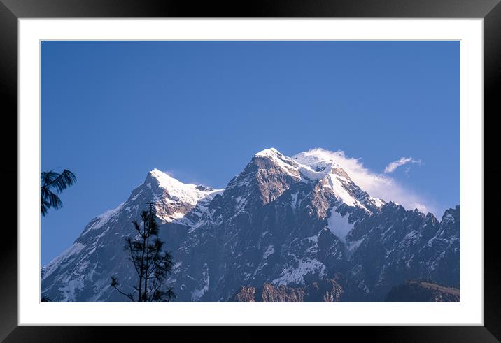 A snow covered mountain range Framed Mounted Print by Ambir Tolang
