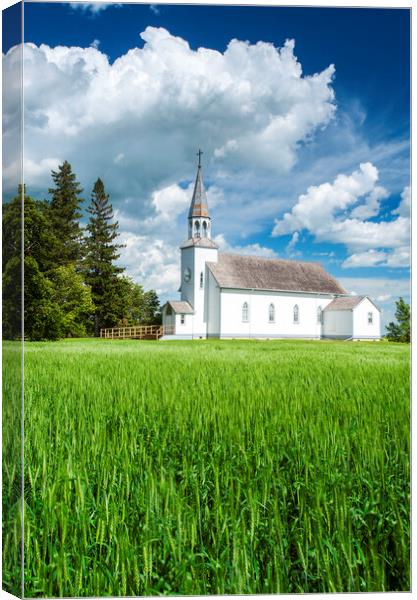wheat field with historic Chapelle St. Thérèse church Canvas Print by Dave Reede