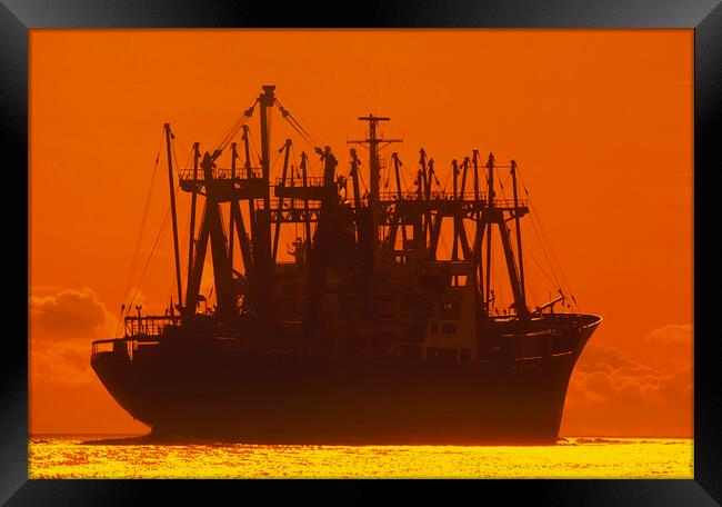 Freighter on the Open Ocean       Framed Print by Dave Reede