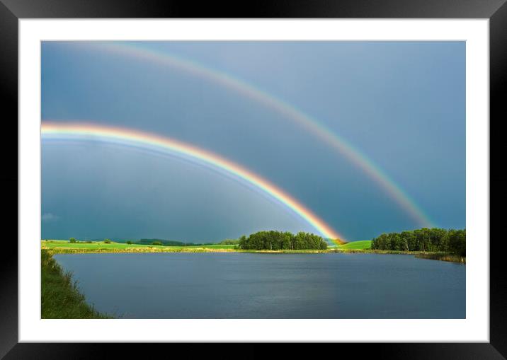 prairie slough with farmland and rainbow in the ba Framed Mounted Print by Dave Reede