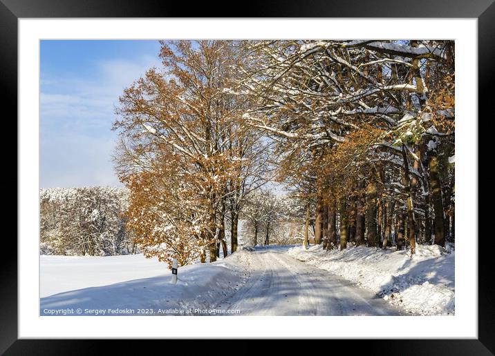 Road in the countryside after heavy snowfall in central Europe Framed Mounted Print by Sergey Fedoskin