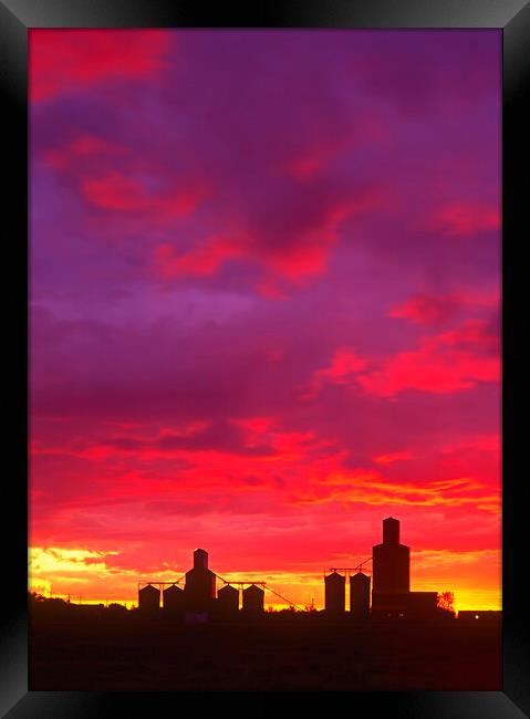 sunset over grain elevators Framed Print by Dave Reede