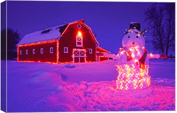 snowman in Front of Red barn Canvas Print by Dave Reede