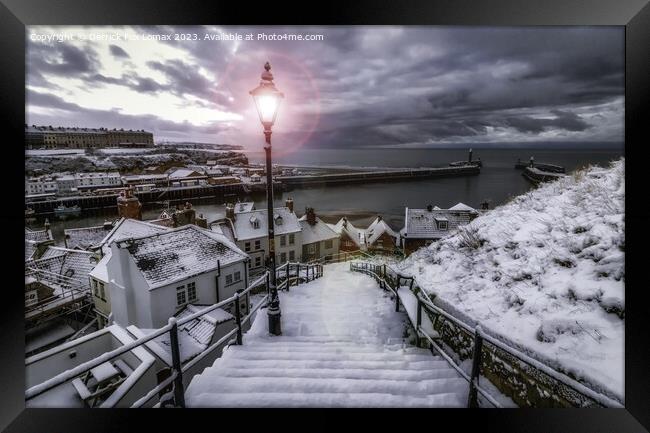 Whitby in a snowy winter Framed Print by Derrick Fox Lomax