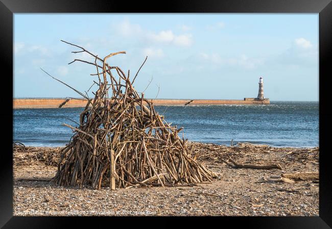 Driftwood stack on Roker beach  Framed Print by Bryan Attewell